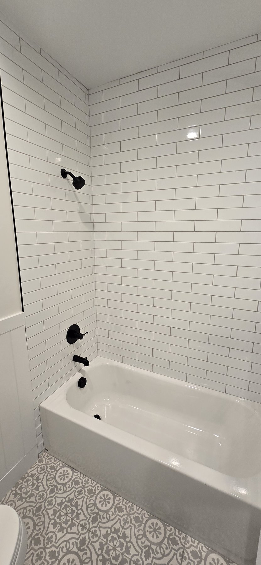 Real photo of third bathroom tub and shower
