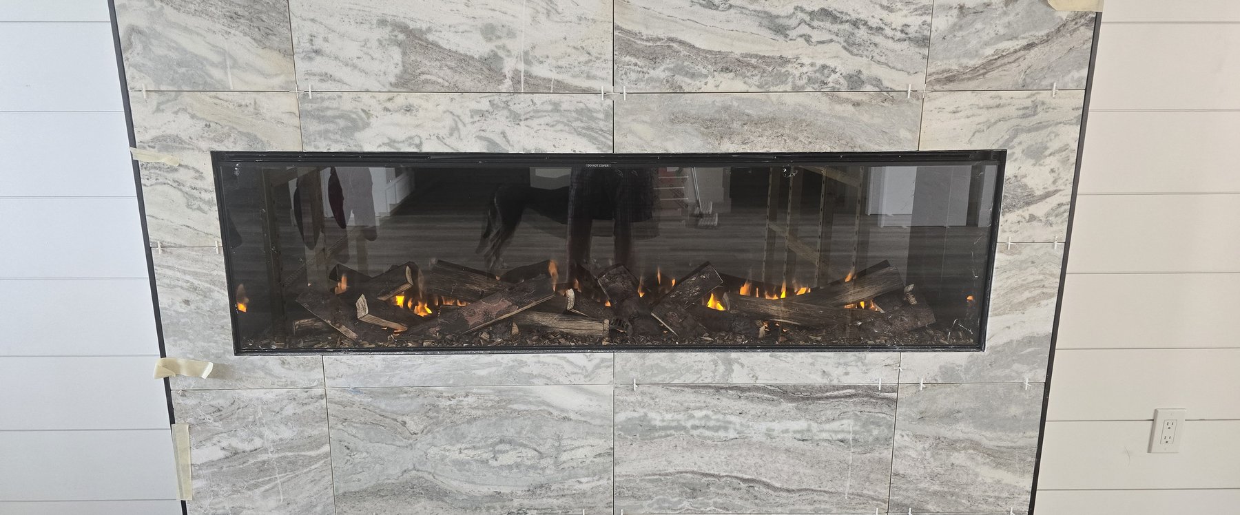 Real photo of electric fireplace insert lit