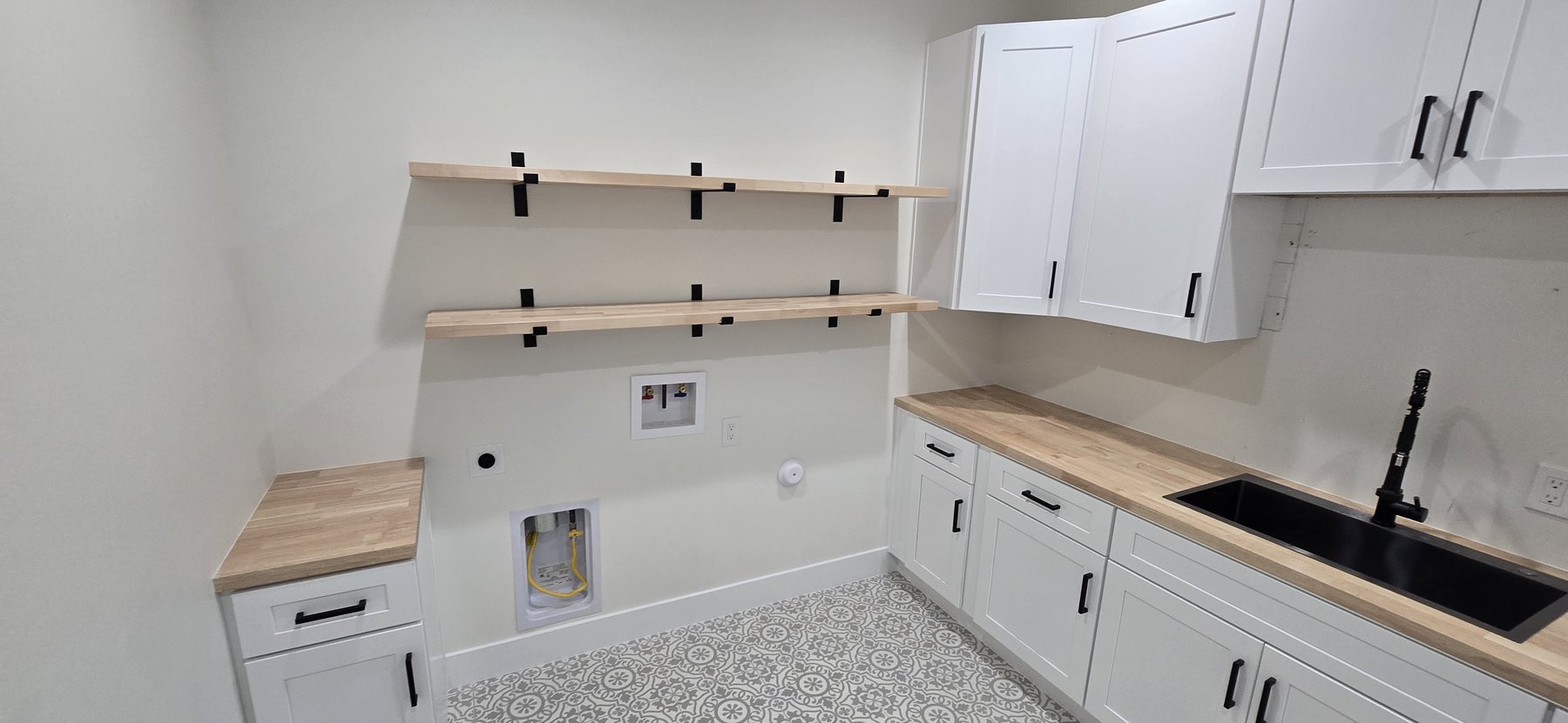Real photo of laundry room with open shelving